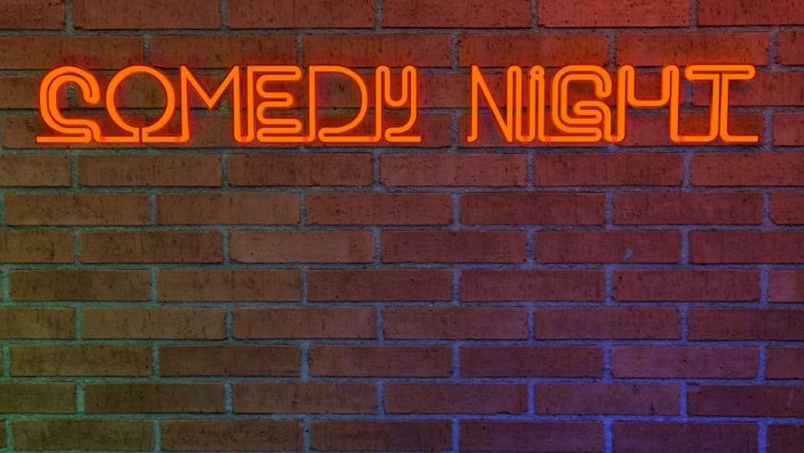 comedy night in neon text