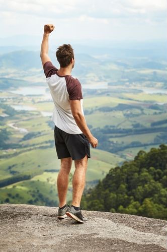 man in a mountain having a peace of mind