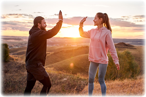 couple-of-athletes-giving-high-five-for-98469959