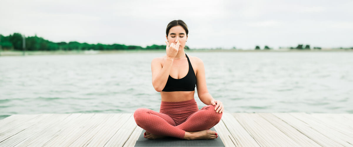 A girl doing exercise on a yoga mat