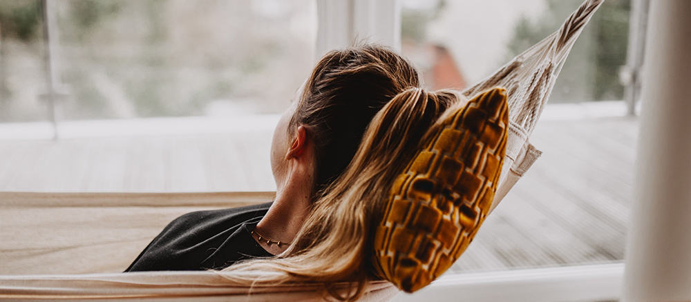 A girl relaxing, looking outside the window