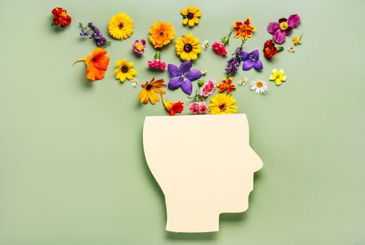 Head illustration with flowers at the top