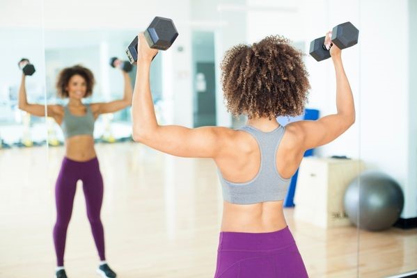 Woman lifting a heavy weight