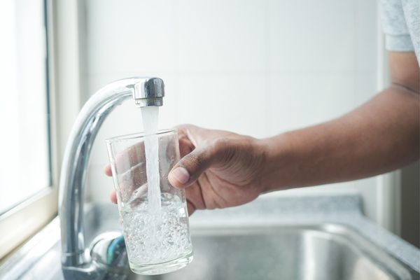 Pouring water to glass