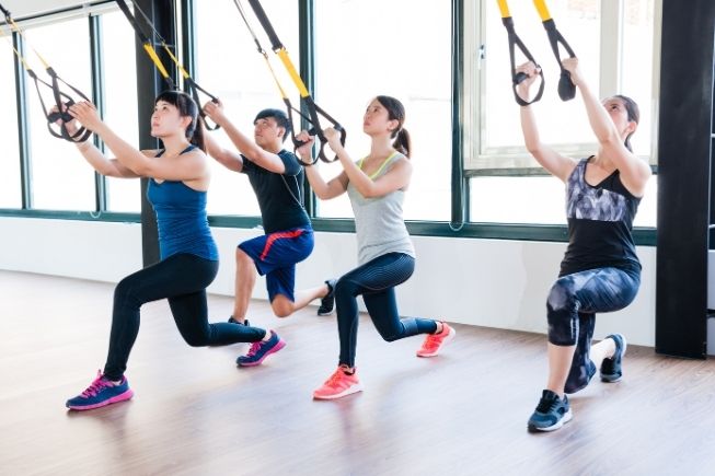group of people training with resistance bands