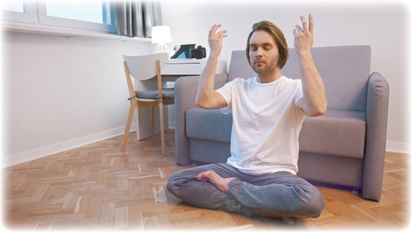 young-caucasian-man-meditating-in-his-89100253